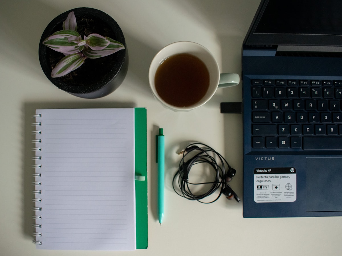 Think Fanny editorial desk setup with notebook, pen, and puzzle worksheets