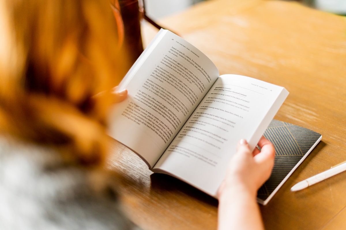 Think Fanny word puzzle vibe with a person reading a book